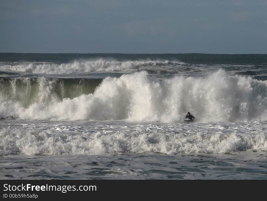 Bodyboarder in front of the wave. Bodyboarder in front of the wave