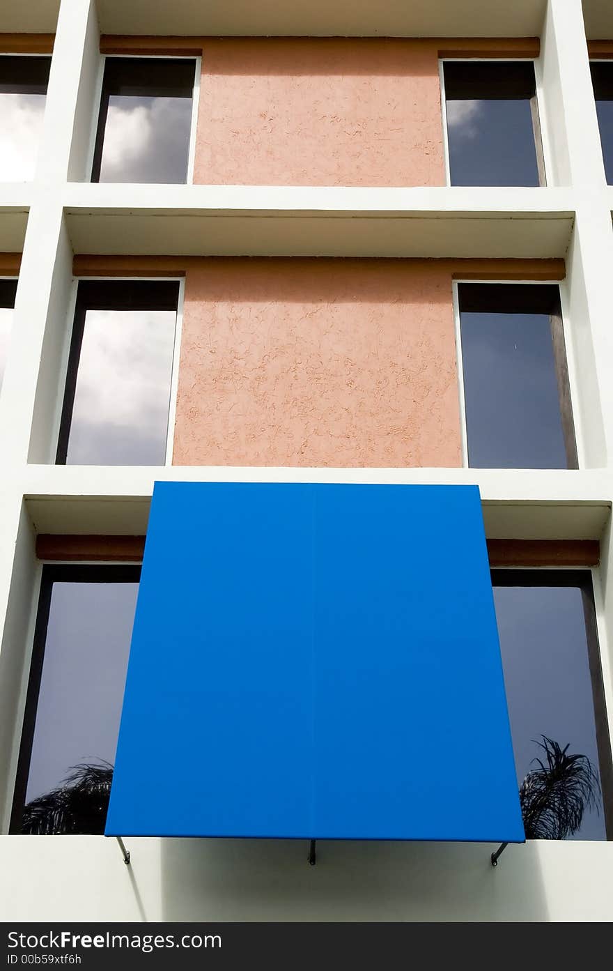 Modern office building tower showing vibrant color blue awning,can be used to lay down type. Modern office building tower showing vibrant color blue awning,can be used to lay down type