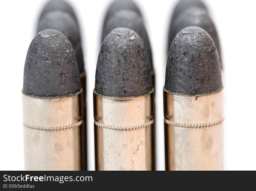 Cartridge for a handgun and a white background