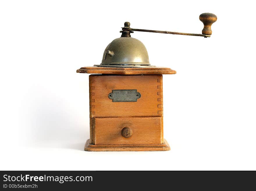 A coffee grinder and a white background. A coffee grinder and a white background