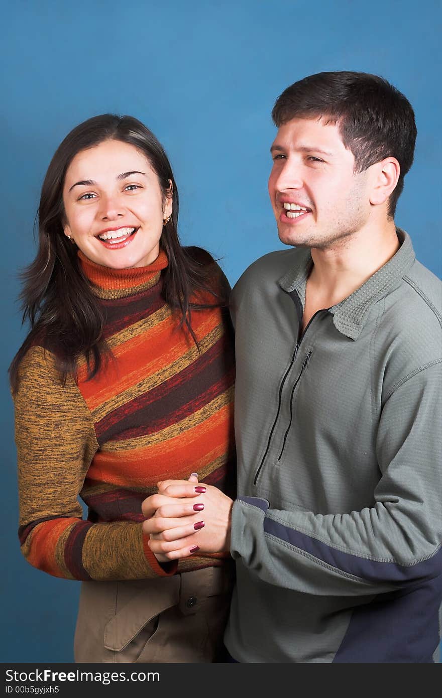 Young happy couple dansing and smiling