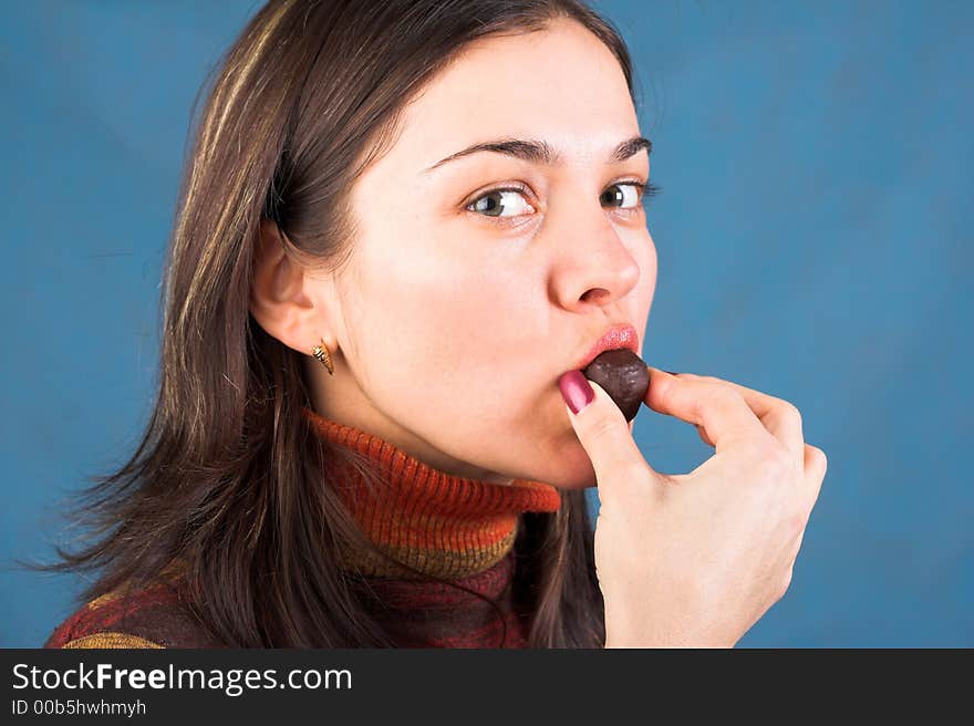 Young brunette woman with chocolate