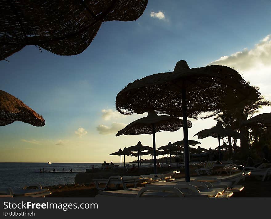 Parasols silhouette on the beach