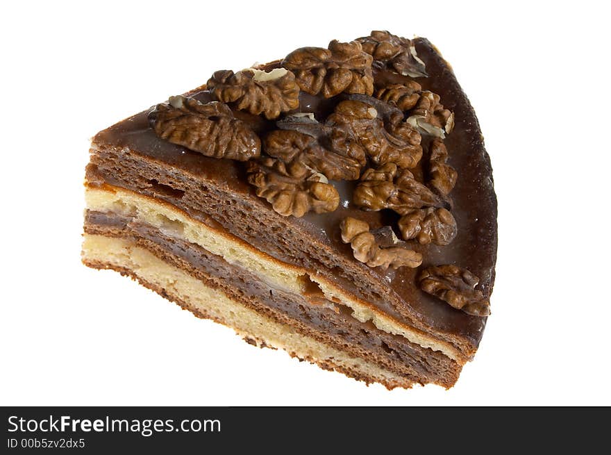 Piece of cake decorated with walnuts. Piece of cake decorated with walnuts