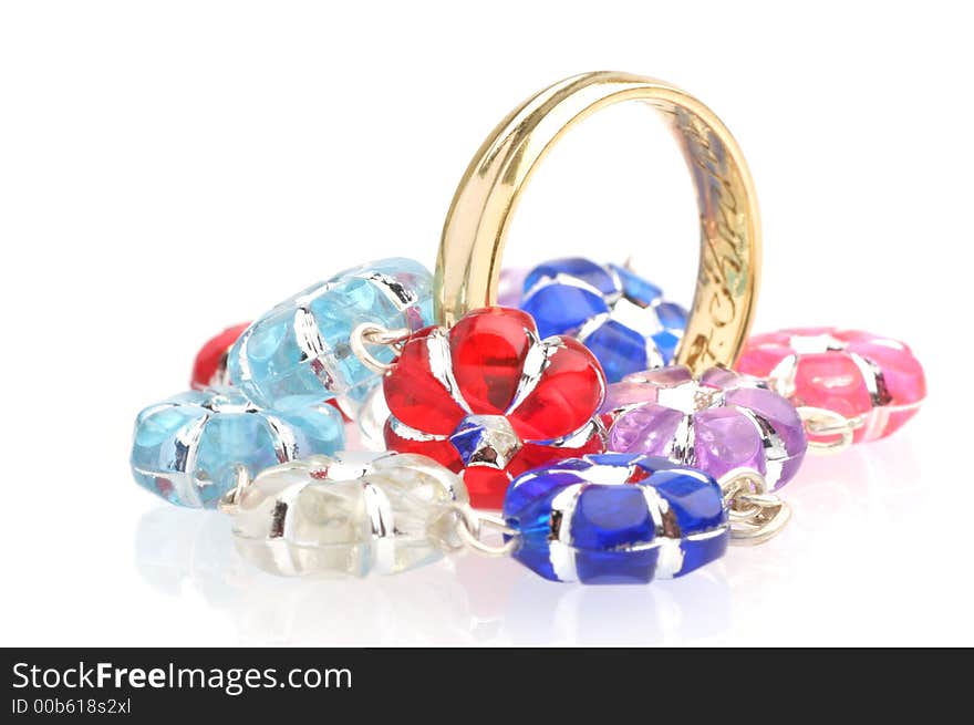 Wedding ring and colourfull beads.