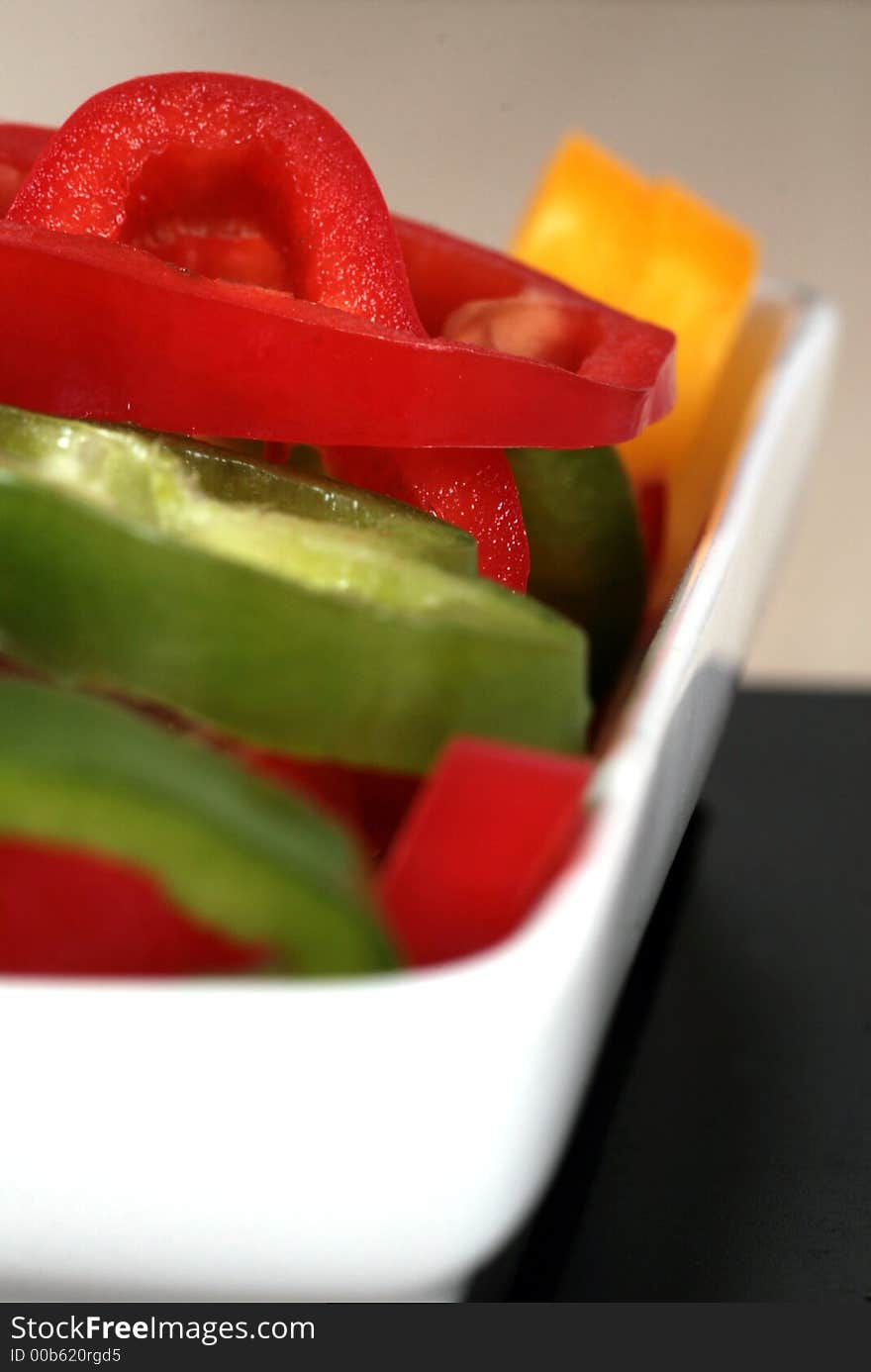 Healthy peppers in three different colors ready to beeing dipped. Healthy peppers in three different colors ready to beeing dipped.