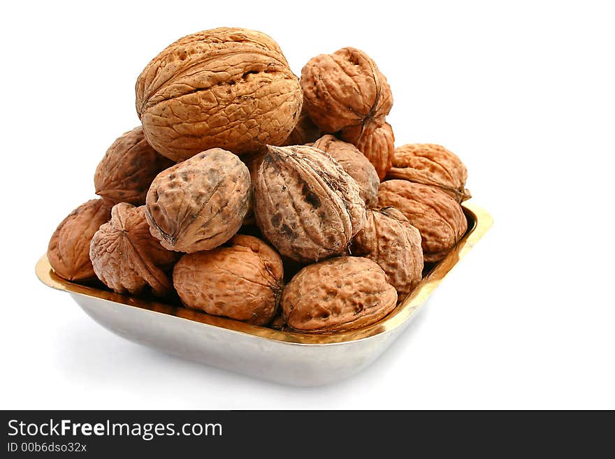 Walnuts over a white background