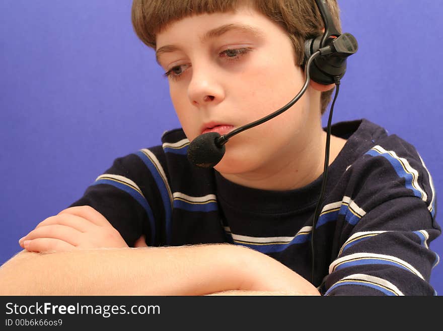 Young boy on telephone blue background