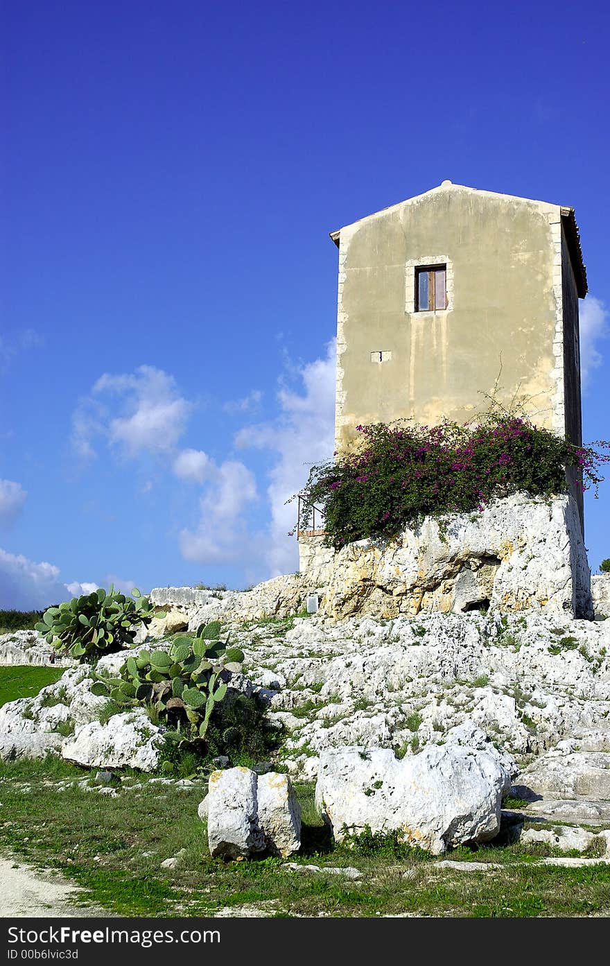 Old spanish house atop ancient greek ruins in italy