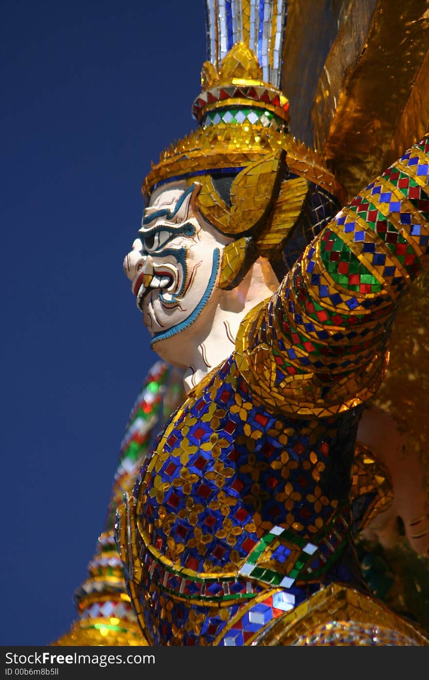 Guardian figure at Wat Phra Keo, Grand Palace, Bangkok, Thailand. Guardian figure at Wat Phra Keo, Grand Palace, Bangkok, Thailand.