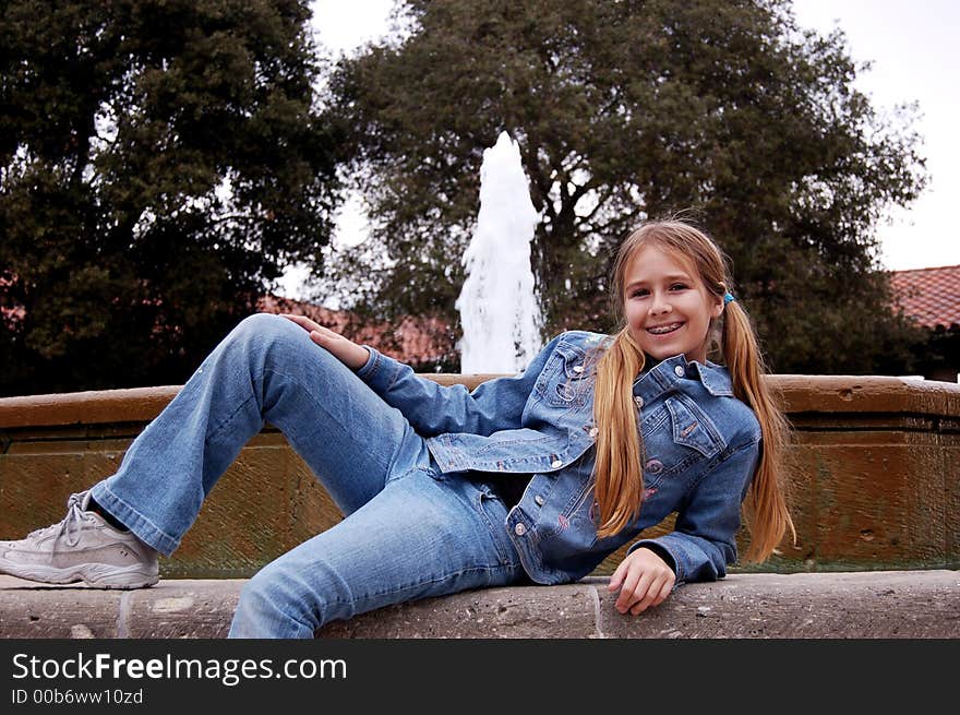 Girl in front of fountain