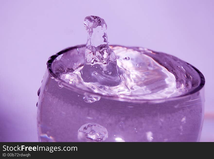 Glass with water, splashes waterdrops, bubbles. Glass with water, splashes waterdrops, bubbles