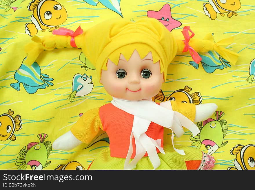 Yellow doll on a bright background. Yellow doll on a bright background