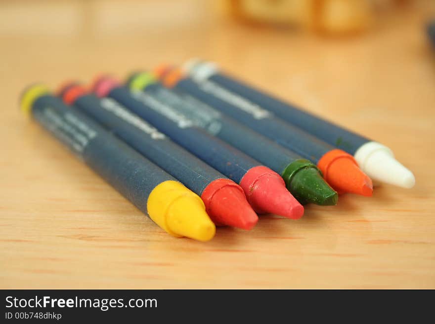 The colored pencils on the table