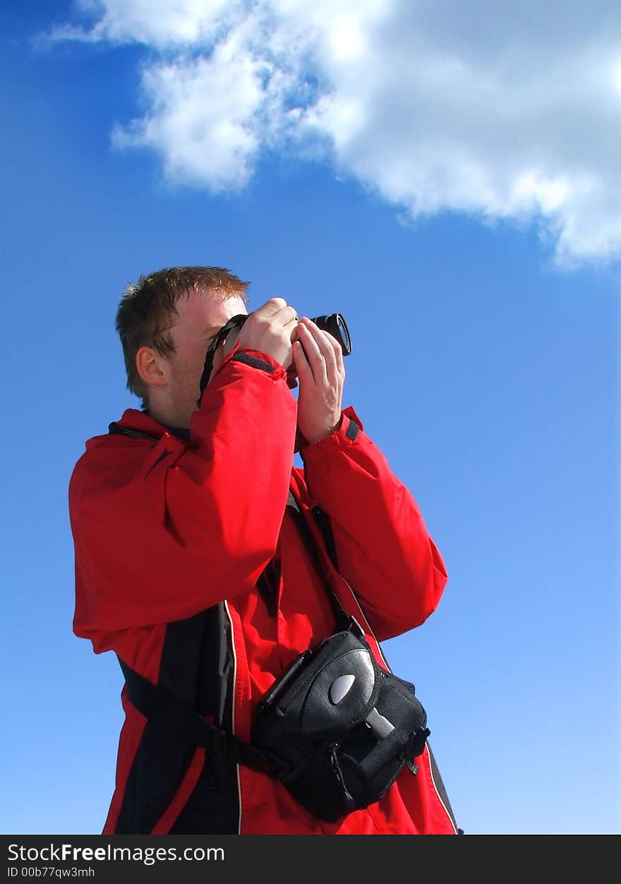 Young photographer taking photo from beautiful nature