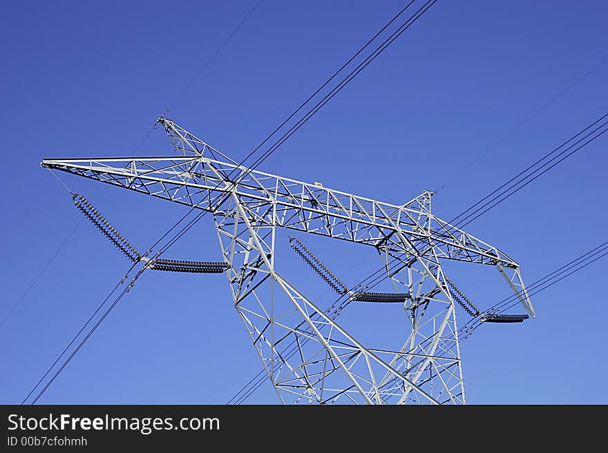 High power electrical pylon against a blue sky. High power electrical pylon against a blue sky