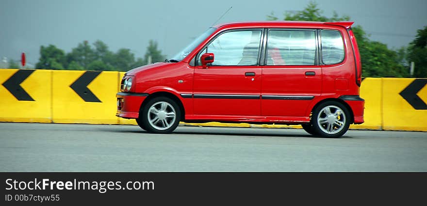 Red compact saloon car