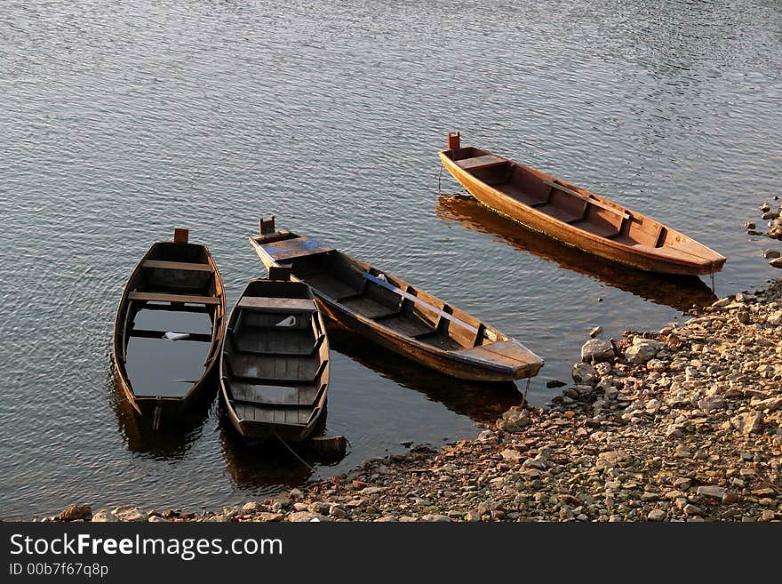 River boats anchor on the beach