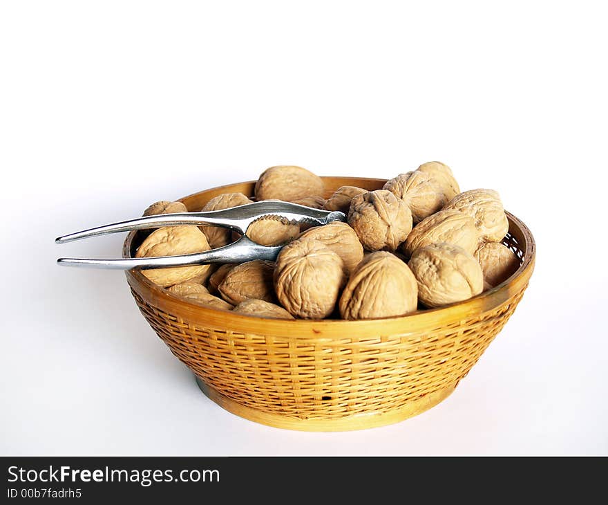 Walnuts in a bowl over white