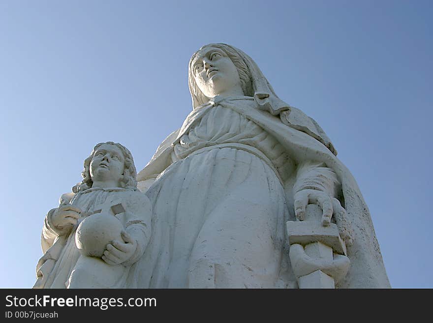 Mont-Dol is a hill northern of Dol-de-Bretagne in the east of Brittany (France). There is a belvedere. At the top of this tower a statue of the Virgin Mary with child is placed. Mont-Dol is a hill northern of Dol-de-Bretagne in the east of Brittany (France). There is a belvedere. At the top of this tower a statue of the Virgin Mary with child is placed.