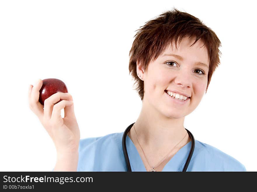 Cute nurse holding a red apple on white. Cute nurse holding a red apple on white