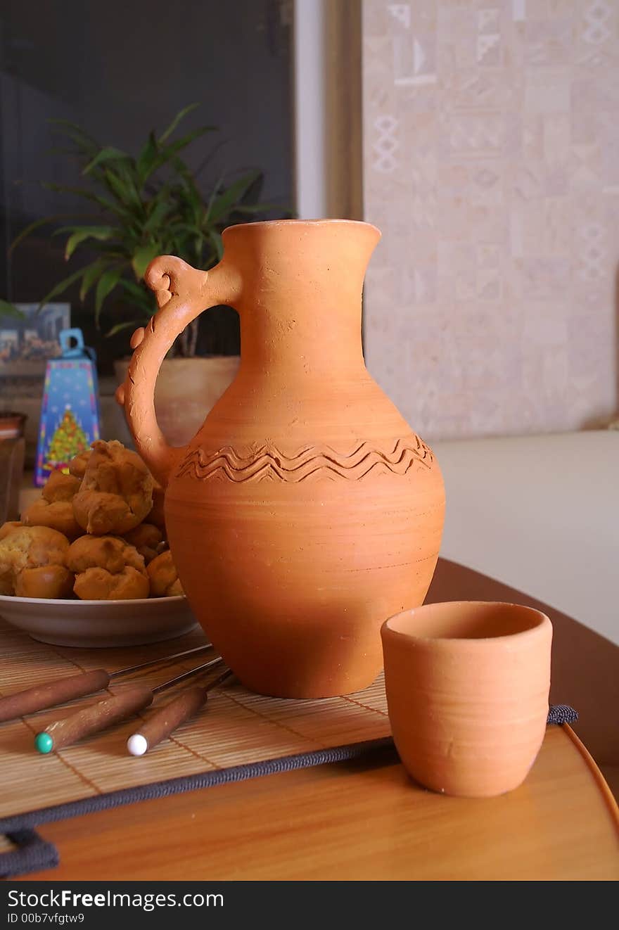 The jug and the cup on a table