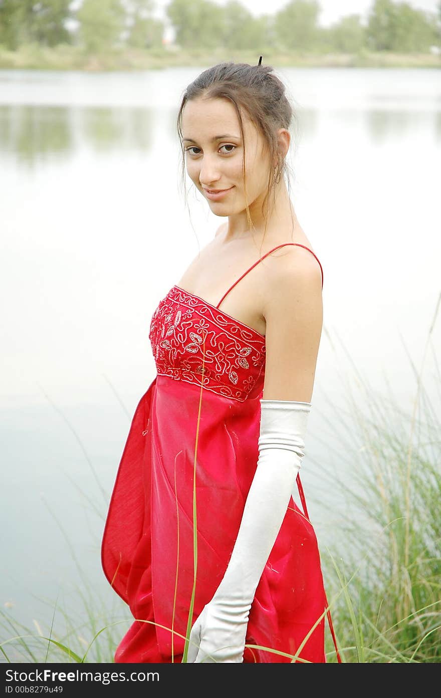 Fashion shot of a beautiful girl in red dress