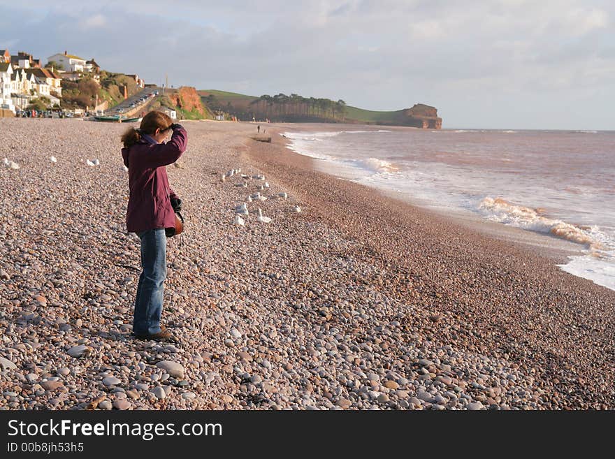 Single woman looking out to sea. Single woman looking out to sea