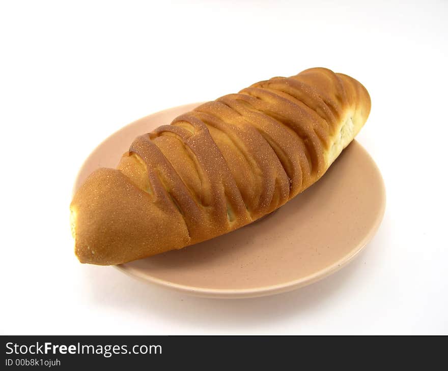 Beautiful bread on a plate on a white background