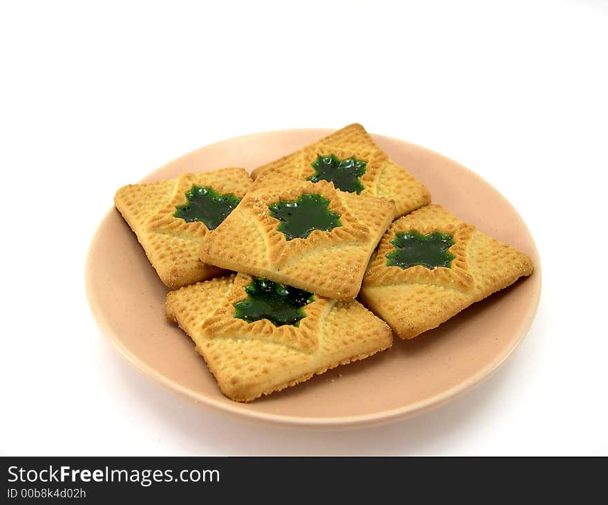 Beautiful cookies on a plate on a white background