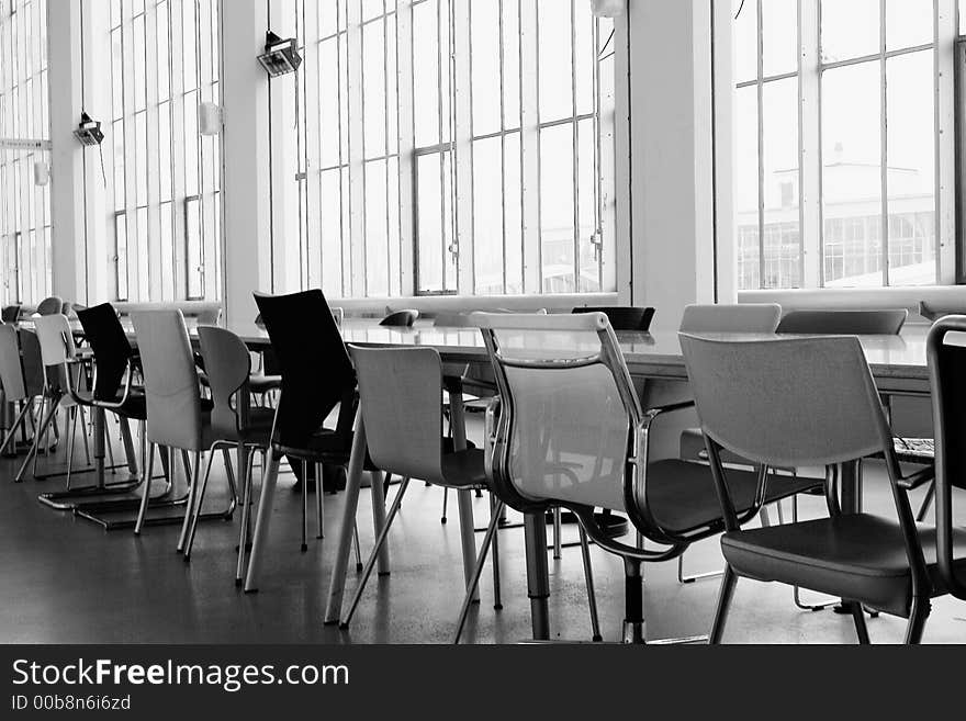 Difference, a lot of chairs next to an enormous table