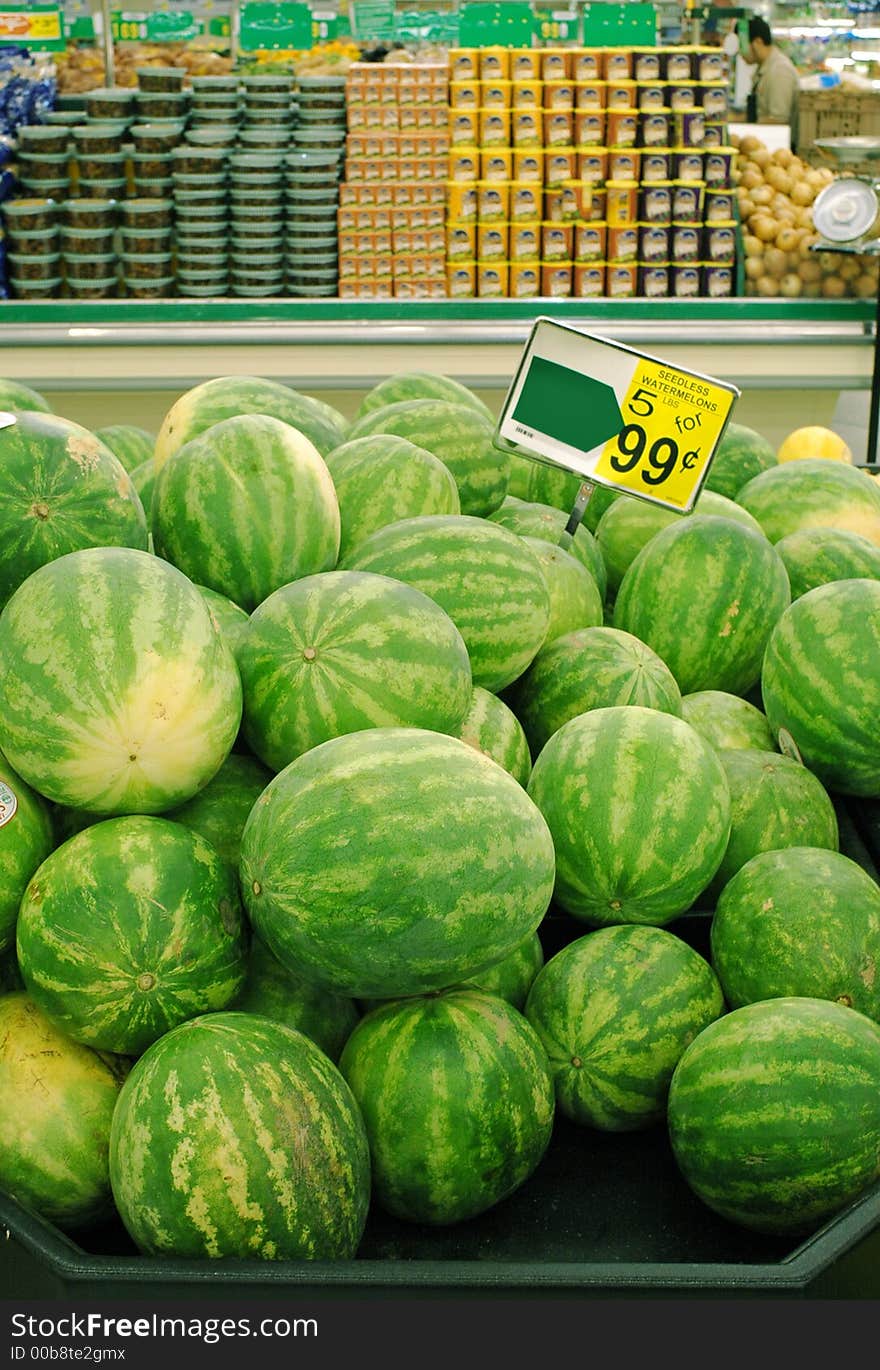 A pile of watermelons in a supermarket. A pile of watermelons in a supermarket