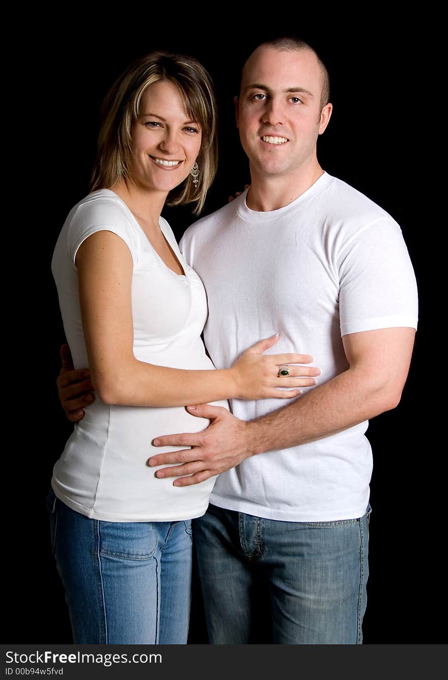 Woman and man in white looking at camera. Woman and man in white looking at camera