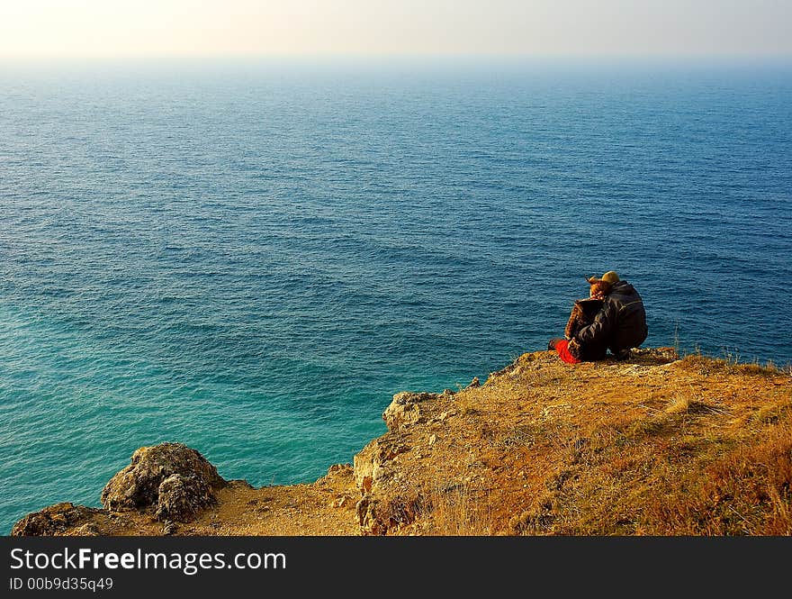 Loving couple on the coast of sea. Loving couple on the coast of sea