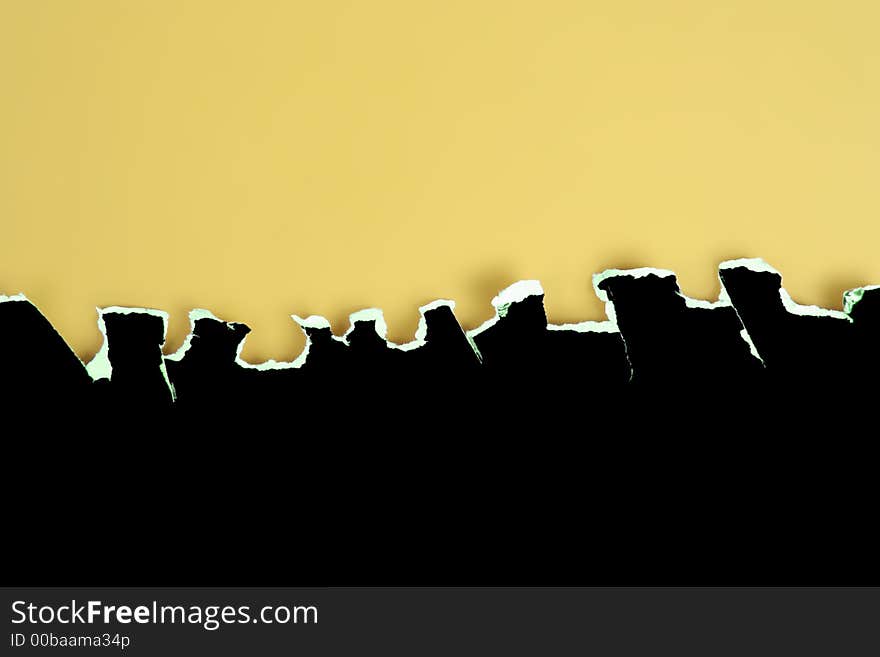 Black card rough jagged tear on a yellow background. Black card rough jagged tear on a yellow background