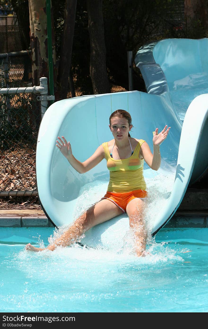 Girl sliding on water slide