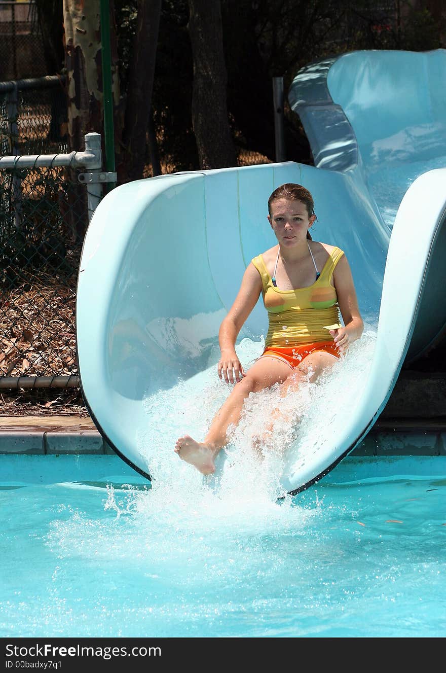 Girl sliding on water slide