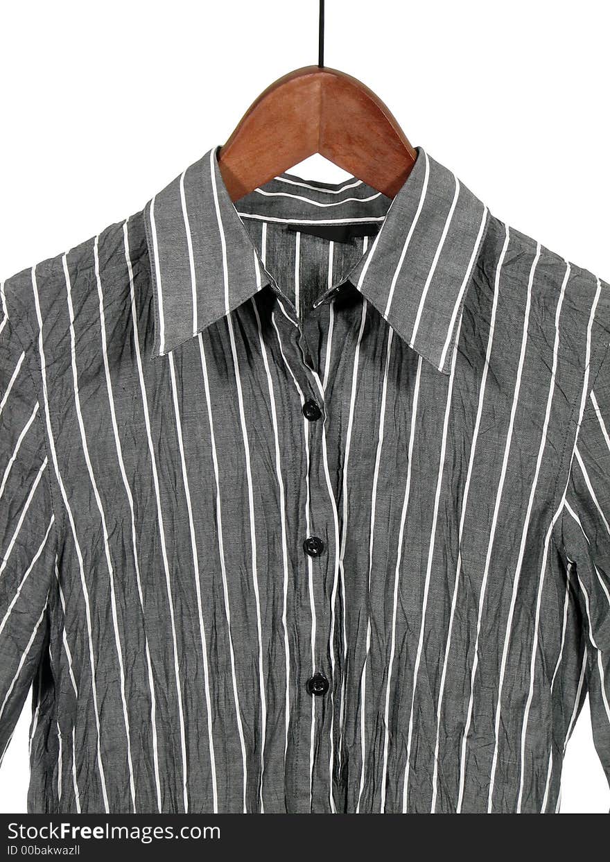 Gray striped shirt on wooden hanger, isolated on white.