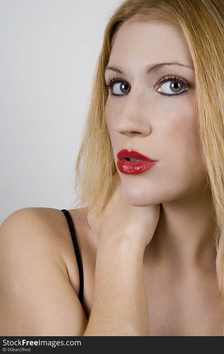 Woman puckering up with red lipstick. Woman puckering up with red lipstick