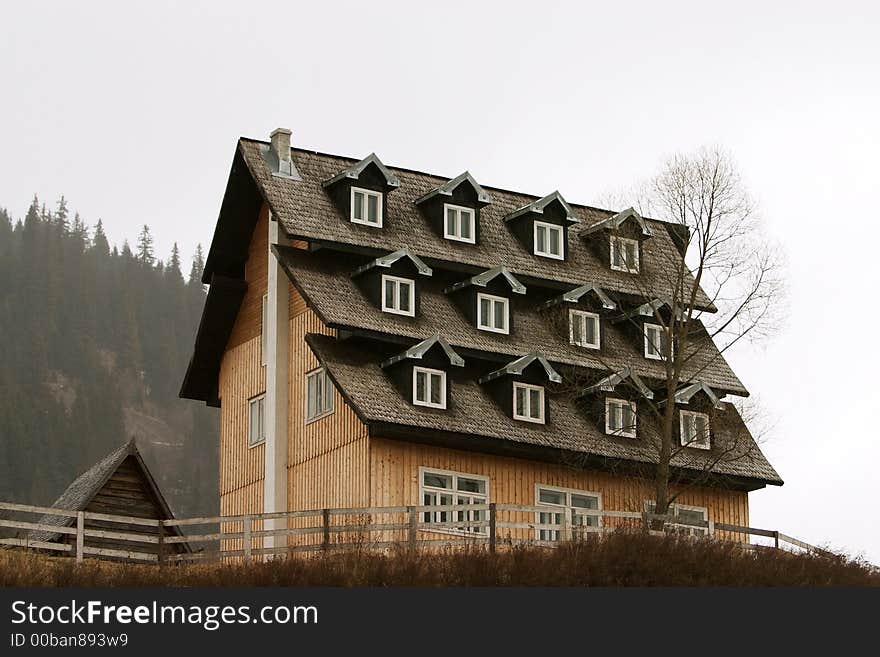 Cottage with a roof full of windows. Cottage with a roof full of windows