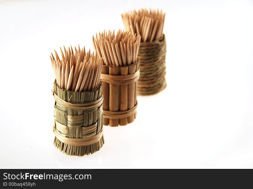 Wooden toothpicks on white background