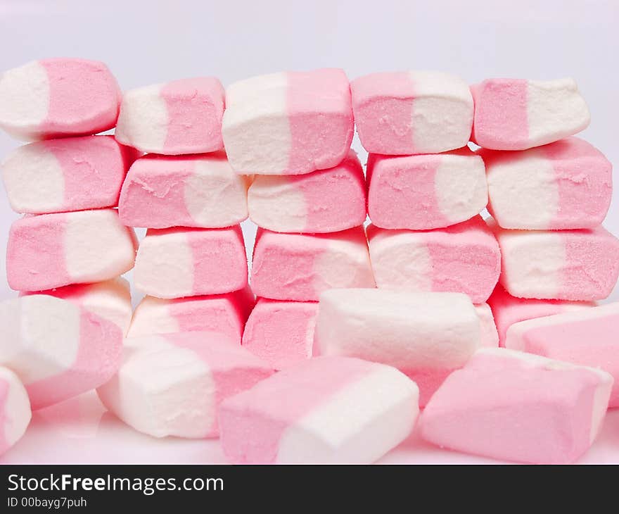 A lot of pink sweet candies. A lot of pink sweet candies