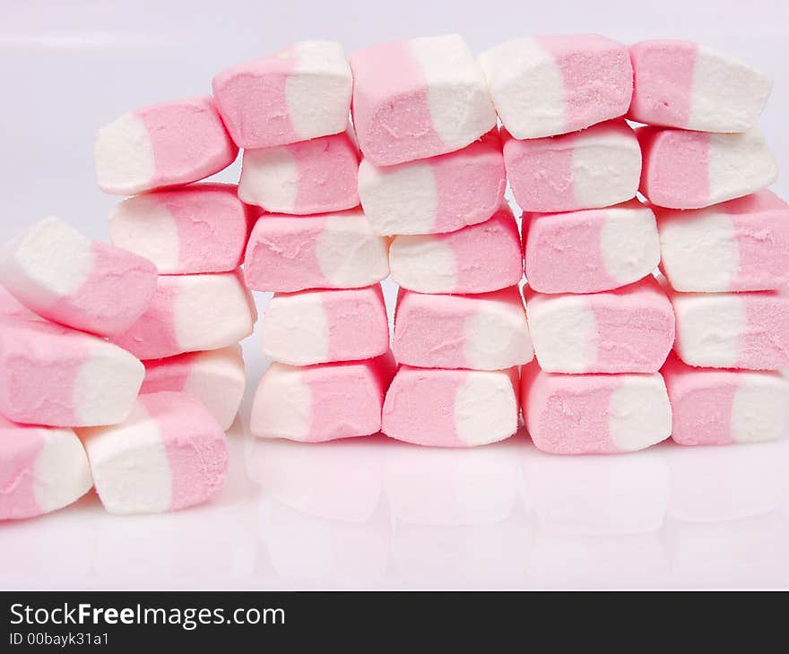 A lot of pink sweet candies. A lot of pink sweet candies