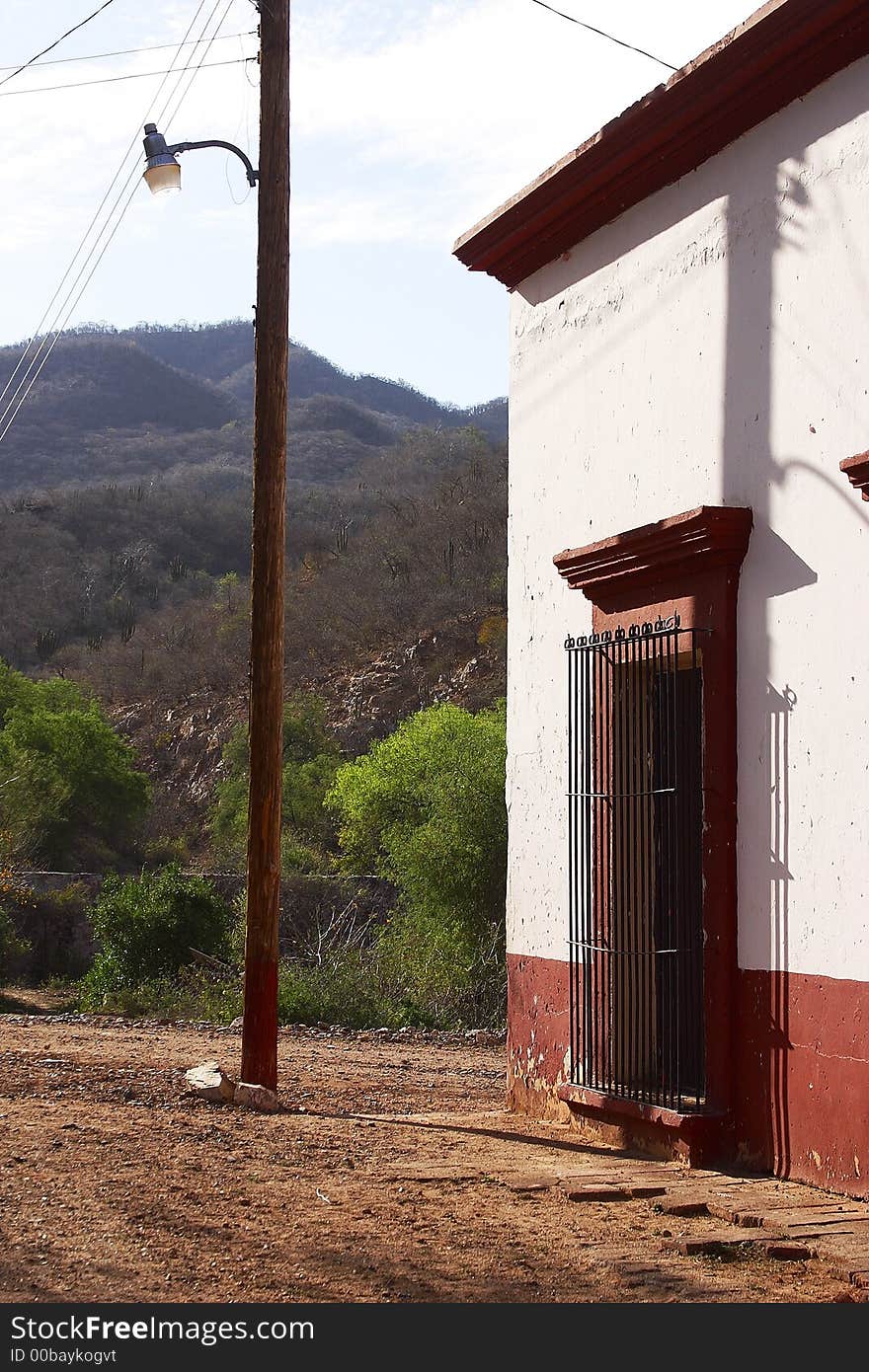 Typical colonial house with window in the town of Alamos, in the northern state of Sonora, Mexico, Latin America