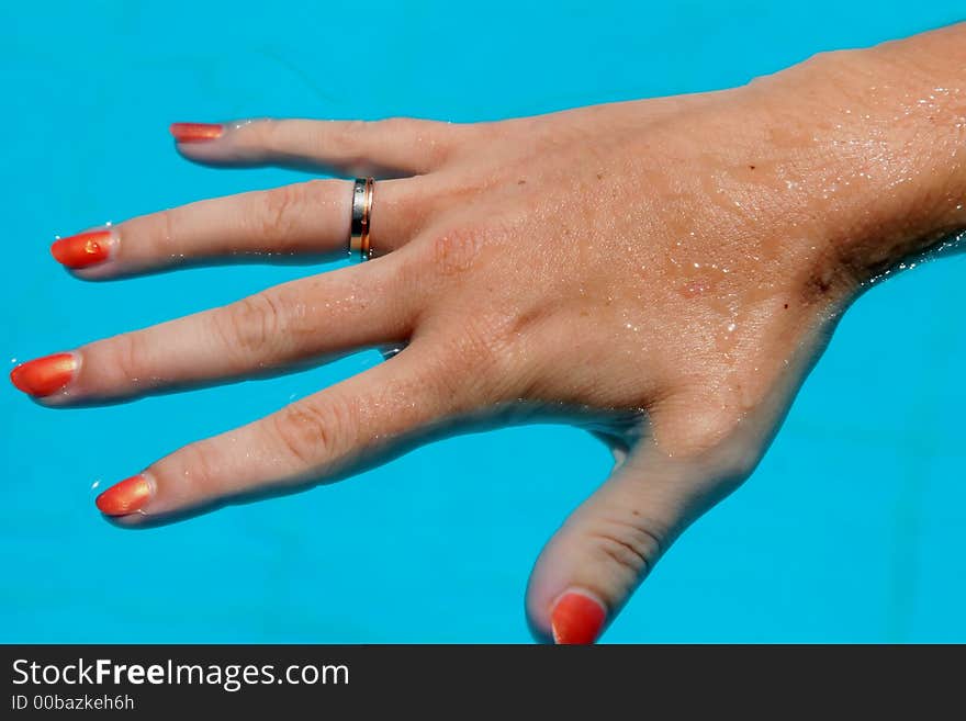 Hand in water with ring