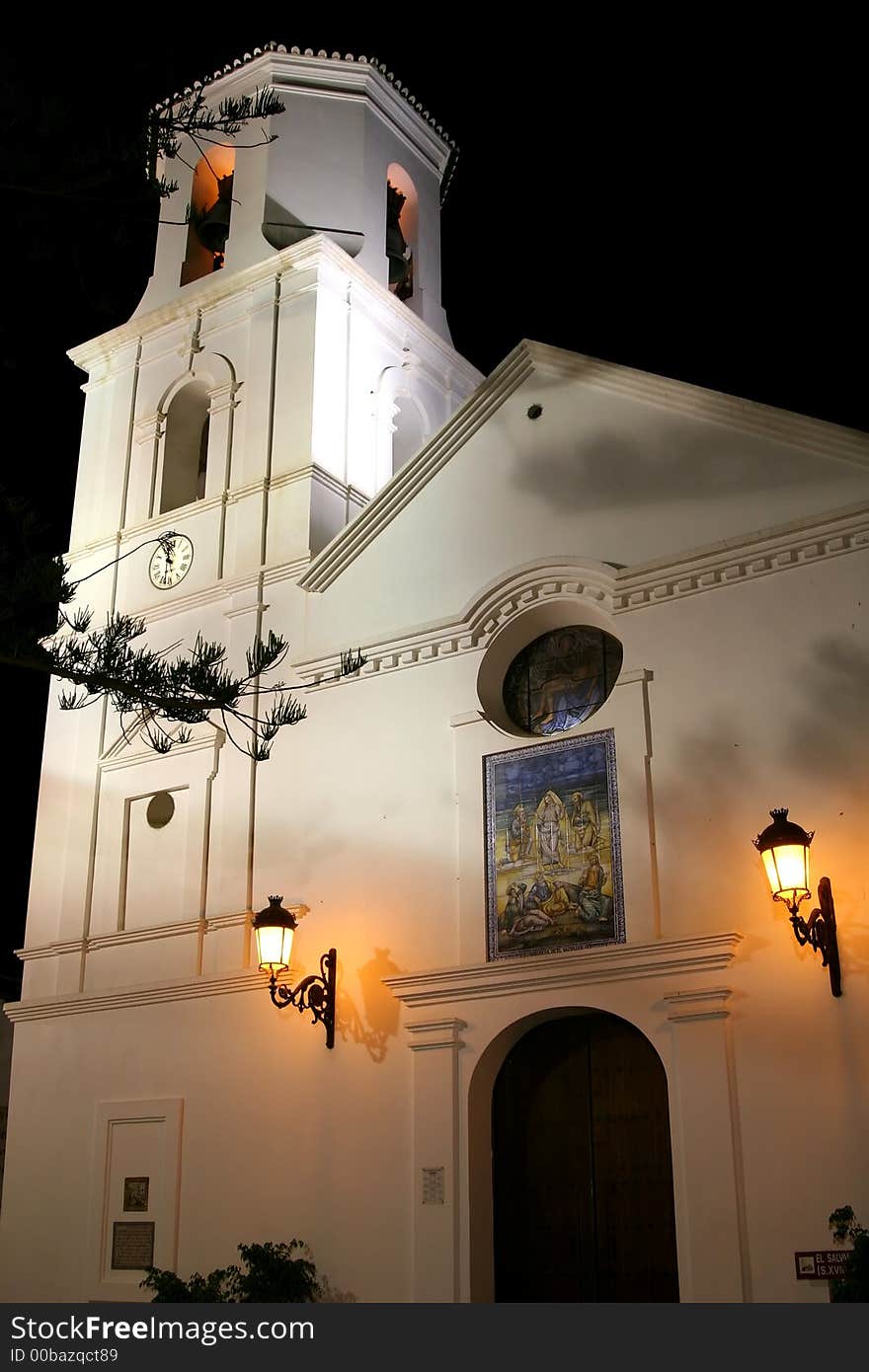 Little white church at night.