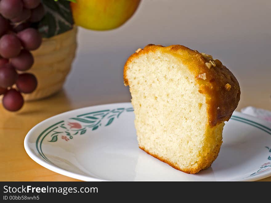 Half a banana nut muffin for a quick snack with fruit. Half a banana nut muffin for a quick snack with fruit