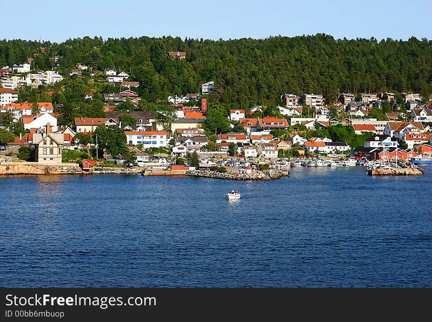 A village harbour on a fjord approaching Oslo, Norway. A village harbour on a fjord approaching Oslo, Norway