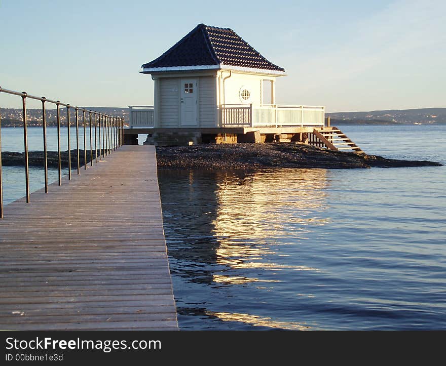 A bathhouse with terasses and stairs to the sea. Oslofjorden, Norway.