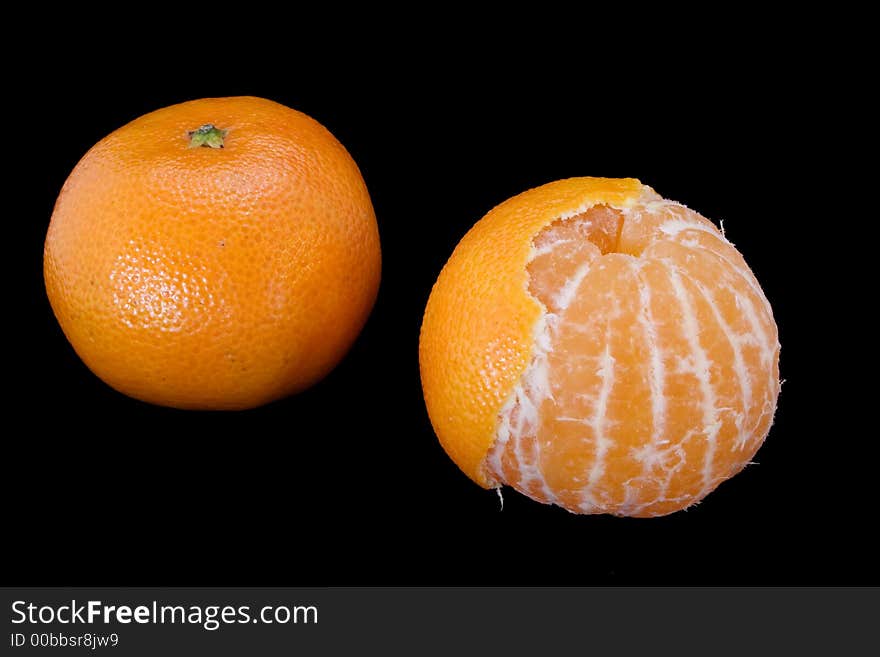 Pair tangerines isolated on black